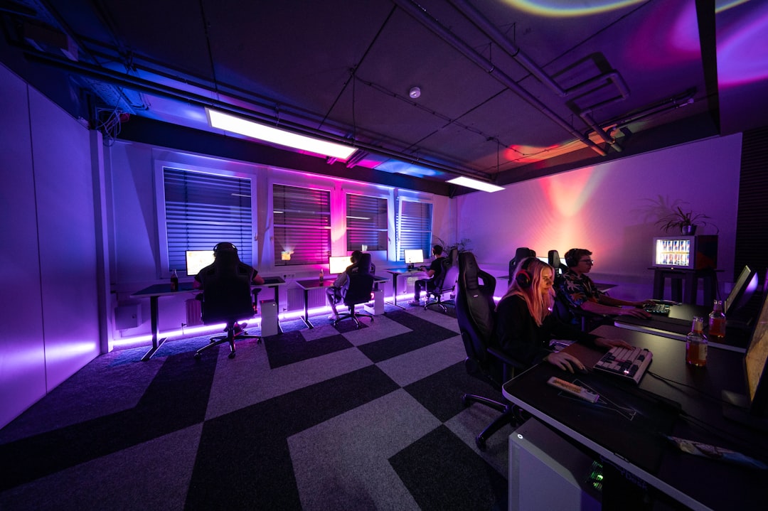 A Modern High End Workspace Featuring A Diverse Group Of Professionals Engaged In Digital Training