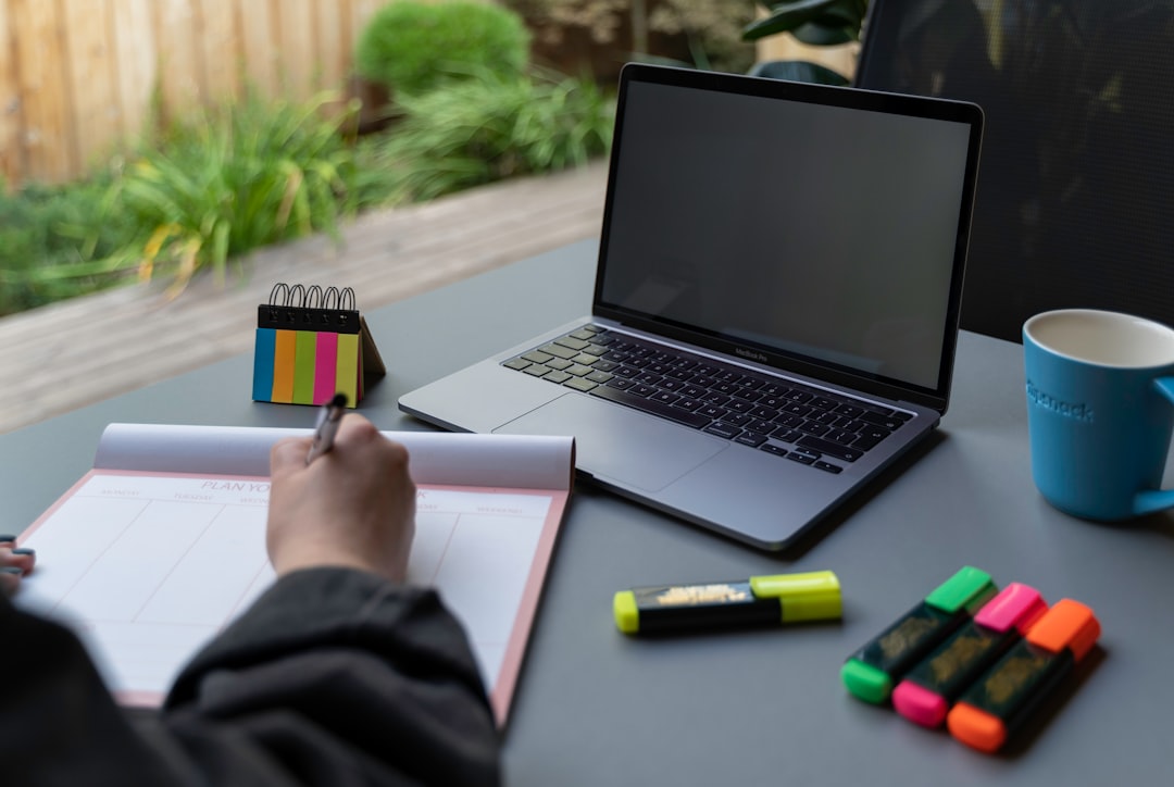 A Modern High End Workspace Featuring A Laptop Digital Marketing Tools And A Notepad With Notes O