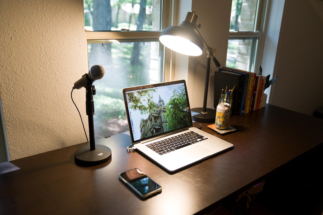 A Modern High End Workspace Featuring A Laptop Notepad And Coffee Cup With A Bright Window Showi